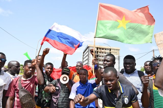 Demonstrators waved Russian and Burkina flags in a protest against West African bloc ECOWA