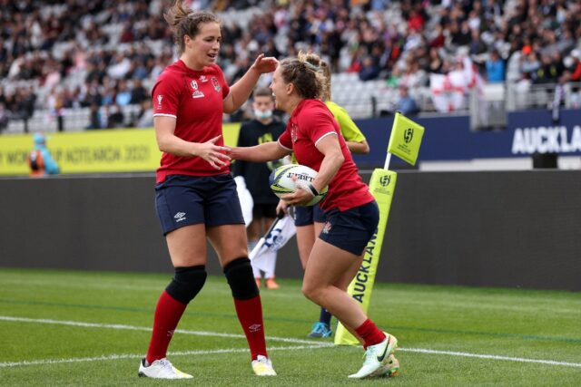 Emily Scarratt (L) celebrates with England try-scorer Claudia MacDonald in their women's R