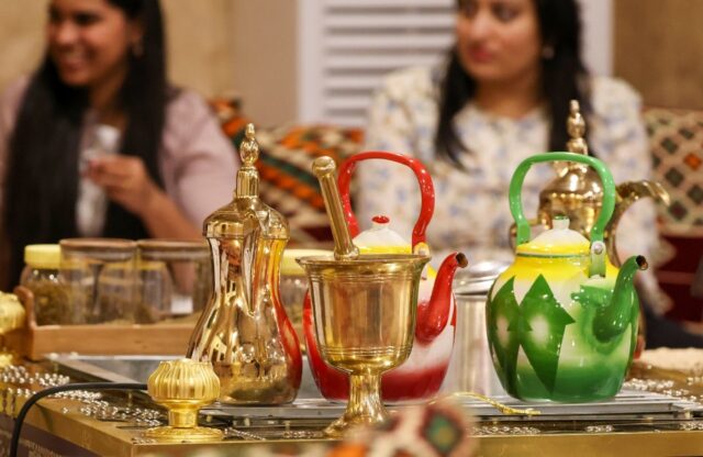 Golden 'dallah' pots are used for traditional 'gahwa', prepared by roasting coffee beans t