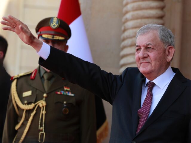 Iraq's newly-elected President Abdul Latif Rashid waves during his inauguration and handov