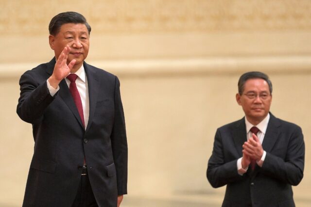 Li Qiang (R) is one of Chinese President Xi Jinping's most trusted proteges and almost cer