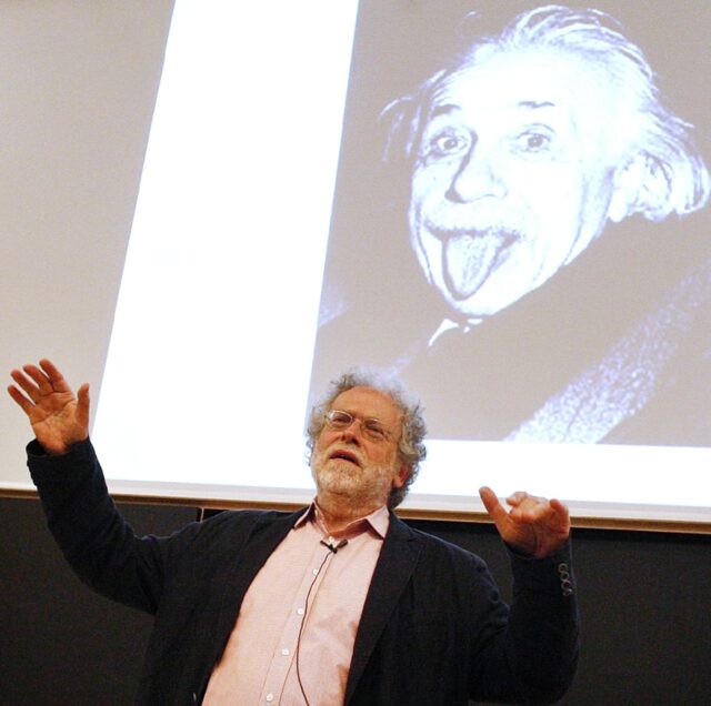 New Nobel laureate Anton Zeilinger in front of a famous picture of Albert Einstein stickin