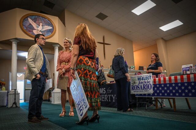 A school board campaign event in Vero Beach, Florida, gets under way inside a church.