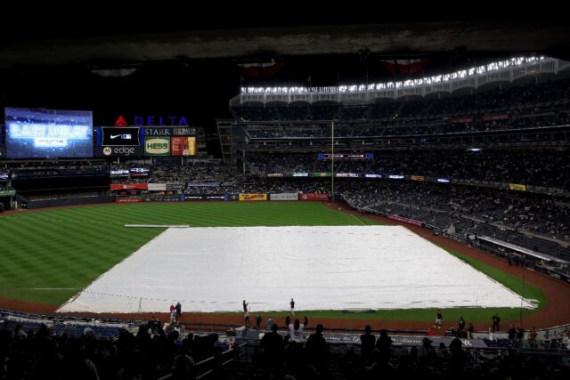 A tarpaulin covers the infield at Yankee Stadium ahead of Monday's postponed Yankees-Guard