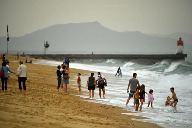 Warm October weather has seen many flock to the beach -- such as here at Hossegor, southwe