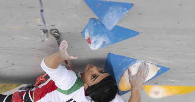 Iranian Rock Climber Who Competed Without Hijab Returns Home - Breitbart