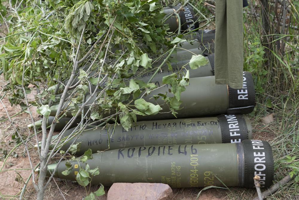 U.S.-supplied M777 howitzer shells lie on the ground to fire at Russian positions in Ukraine's eastern Donbas region June 18, 2022. The intense firefight over Ukraine has the Pentagon rethinking its weapons stockpiles. If another major war broke out today, would the U.S. have enough ammunition to fight? It’s a question Pentagon planners are grappling with not only as the look to supply Ukraine for a war that could stretch for years, but also as they look to a potential conflict with China. (AP Photo/Efrem Lukatsky, File)