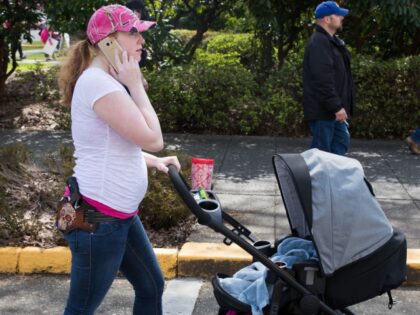 OLYMPIA, WA - APRIL 21: A woman pushes her stroller while open carrying her pistol on the Washington State Capitol campus during a "March For Our Rights" pro-gun rally on April 21, 2018 in Olympia, Washington. (Matt Mills McKnight/Getty Images)