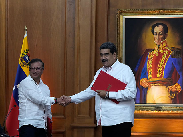 Venezuelan President Nicolas Maduro, right, and Colombia's President Gustavo Petro, shake
