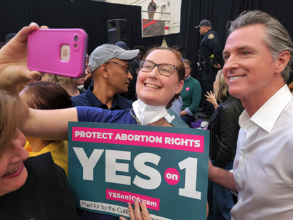 California Gov. Gavin Newsom, right, takes selfies with supporters at a turn out and vote YES on Proposition 1 rally at Long Beach City College in Long Beach, Calif., Nov. 6, 2022. Abortion rights supporters won in the four states where access was on the ballot Tuesday, as voters enshrined …