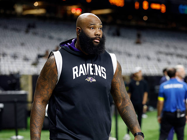 Baltimore Ravens offensive tackle Morgan Moses (78) warms up before an NFL football game a