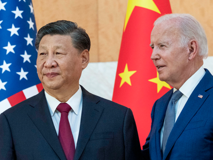 U.S. President Joe Biden, right, stands with Chinese President Xi Jinping before a meeting