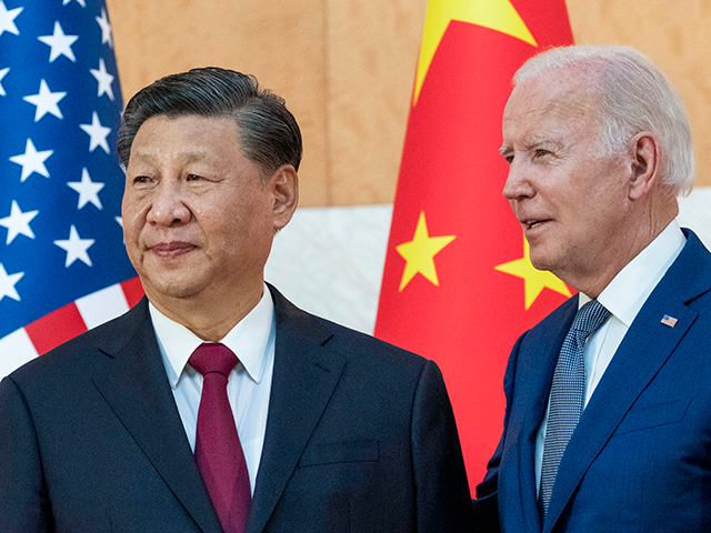 U.S. President Joe Biden, right, stands with Chinese President Xi Jinping before a meeting on the sidelines of the G20 summit meeting, Monday, Nov. 14, 2022, in Bali, Indonesia. Biden says Chinese counterpart Xi has agreed to resume crucial talks on climate between the two countries. The Chinese and U.S. leaders met Monday on the sidelines of the Group of 20 summit in Bali. (AP Photo/Alex Brandon)
