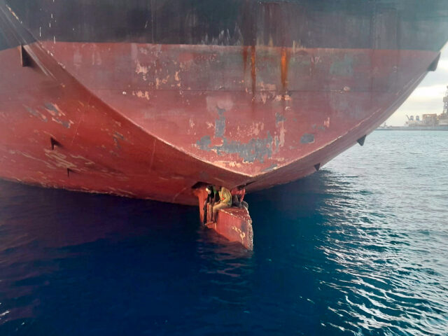 In this photo released by Spain's Maritime Safety and Rescue Society on Tuesday Nov. 29, 2022, three men are photographed on an oil tanker anchored in the port of the Canary Islands, Spain. Spain’s Maritime Rescue Service says it has rescued three stowaways traveling on a ship’s rudder in the …