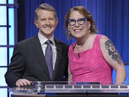 In this undated photo provided by Jeopardy Productions, Inc., "Jeopardy!" host Ken Jennings, left, poses with contestant Amy Schneider. Schneider capped her big year by winning a hard-fought “Jeopardy!” tournament of champions in an episode that aired Monday, Nov. 21, 2022. (Tyler Golden/Sony Pictures Television/Courtesy of Jeopardy Productions, Inc. via …