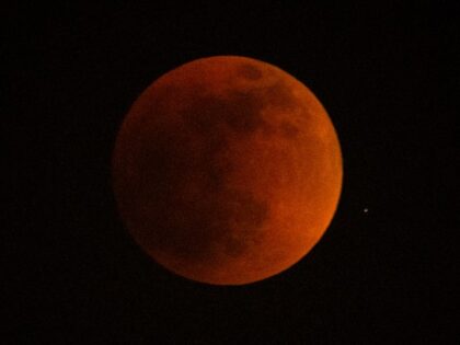 A total lunar eclipse is seen during the first blood moon of the year, in Temple City, Calif. May 15, 2022. (Ringo H.W. Chiu/AP)
