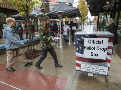 Shasta County Registrar warns of voter intimidation and threats REDDING, CA-NOVEMBER 8, 2022: Redding resident Sirion Yates, 18, right, prepares to place his ballot inside an official ballot drop box as others in background wait in line to vote in person at the Shasta County Clerk & Elections office in …