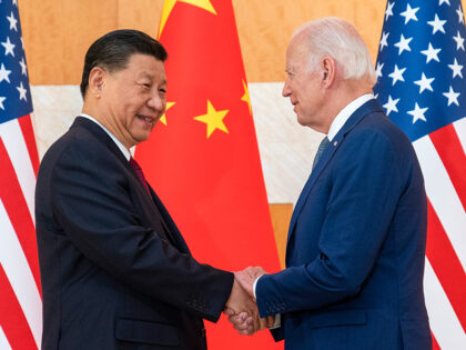 U.S. President Joe Biden, right, and Chinese President Xi Jinping shake hands before a meeting on the sidelines of the G20 summit meeting, Monday, Nov. 14, 2022, in Bali, Indonesia. (AP Photo/Alex Brandon)