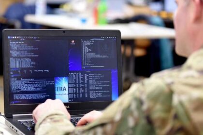 Airman from the Michigan Air National Guard reviews computer information during a cyber-warfare training event, Camp Grayling Joint Maneuver Training Center, Michigan, March 8, 2022. (U.S. Air National Guard photo by Master Sgt. David Eichaker)