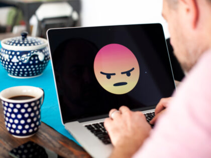 A laptop screen with an angry emoji face displayed is seen in this photo illustration on October 15, 2018 in Warsaw, Poland. (Photo by Jaap Arriens/NurPhoto via Getty Images)