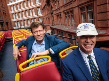 LONDON, ENGLAND - SEPTEMBER 20: MEP and former leader of the UK Independence Party Nigel Farage (R) and businessman Richard Tice ride on the pro-Brexit 'Leave Means Leave' campaign bus in Westminster on September 20, 2018 in London, England. The political campaign group launch a series of billboards today calling …