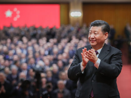 BEIJING, Dec. 18, 2018 (Xinhua) -- Chinese President Xi Jinping, also general secretary of the Communist Party of China Central Committee and chairman of the Central Military Commission, applauds for the personnel awarded with medals during a grand gathering to celebrate the 40th anniversary of China's reform and opening-up at …
