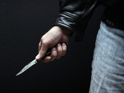 Man brandishing knife in a threatening manner.