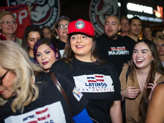 SAN ANTONIO, TX - MAY 14: Jen Salinas, Vice President of Latinos 4 Trump, takes photos wit