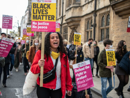 OXFORD, ENGLAND - MAY 25: Protesters march to Oriel Colleges statue of Cecil Rhodes at the