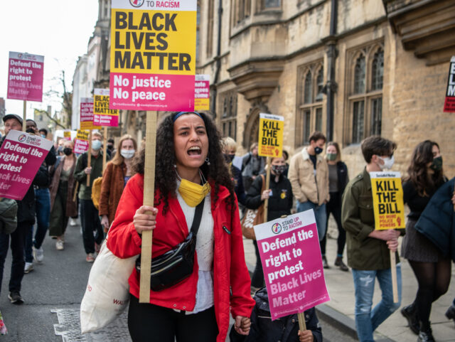 OXFORD, ENGLAND - MAY 25: Protesters march to Oriel Colleges statue of Cecil Rhodes at the University of Oxford on May 25, 2021 in Oxford, England. Today marked the first anniversary of the death of George Floyd, an American man killed by police in the US state of Minnesota, and …