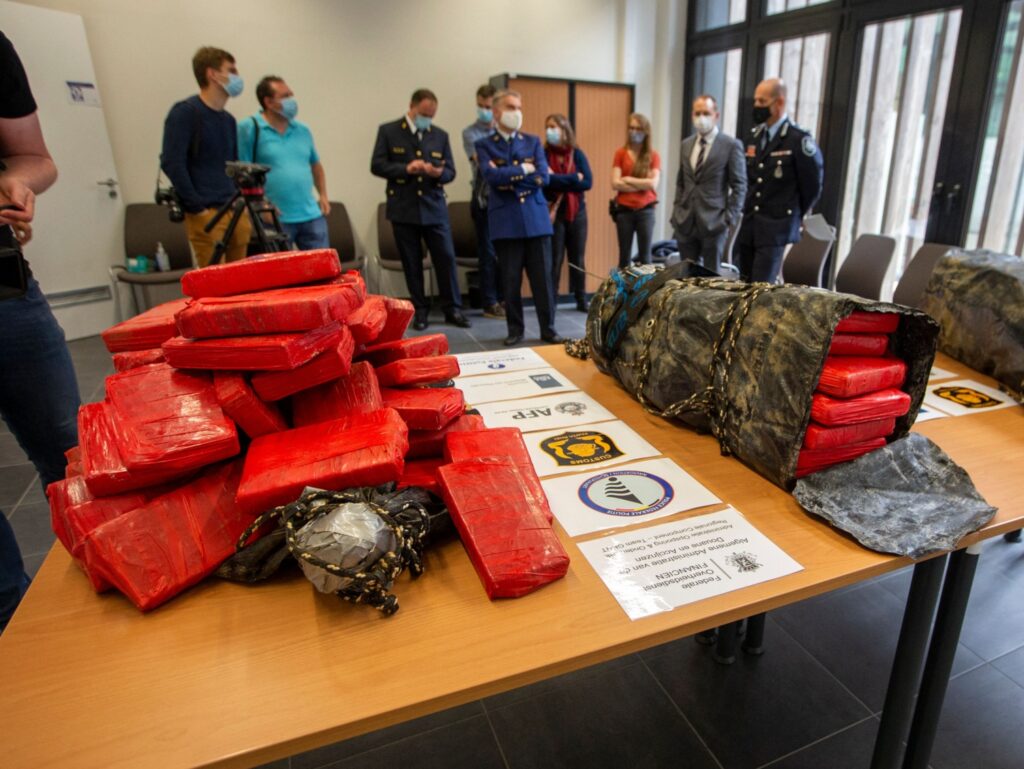 Journalists attend a press conference on a seizure of some 200 kilograms of cocaine, at the Federal Police East Flanders station, in Dendermonde, on June 25, 2021. - On June 21, 2021 the Federal Judicial Police (FGP) East Flanders, together with the Belgian Customs, the Shipping Police (Scheepvaartpolitie) and the diving team of the Dutch Customs, checked a ship carrying orange juice (in bulk) from Santos, Brazil, to the Ghent harbor (North Sea Port). The Australian federal police had shared useful information with the FGP East Flanders as part of an ongoing investigation. - Belgium OUT (Photo by NICOLAS MAETERLINCK / Belga / AFP) / Belgium OUT (Photo by NICOLAS MAETERLINCK/Belga/AFP via Getty Images)