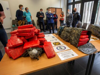 Journalists attend a press conference on a seizure of some 200 kilograms of cocaine, at the Federal Police East Flanders station, in Dendermonde, on June 25, 2021. - On June 21, 2021 the Federal Judicial Police (FGP) East Flanders, together with the Belgian Customs, the Shipping Police (Scheepvaartpolitie) and the …