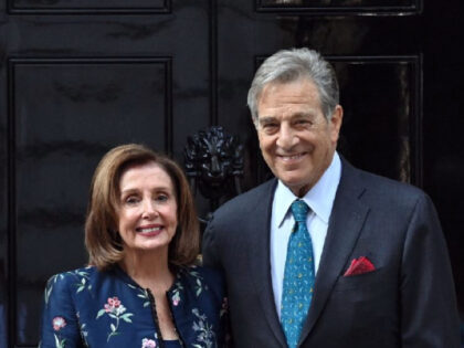 US Speaker of the House, Nancy Pelosi (L) and her husband Paul Pelosi, pose for the media