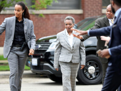 Chicago Police Officer Marni Washington, left, walks with then-Mayor-elect Lori Lightfoot on Sunday, May 19, 2019 at Resurrected Life Church International in the Hermosa neighborhood of Chicago. (Brian Cassella/Chicago Tribune/Tribune News Service via Getty Images)