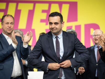 dpatop - 23 April 2022, Berlin: The newly elected FDP Secretary General, Bijan Djir-Sarai (M), stands on the stage after his election. election on stage at the FDP federal party convention. At the first presence party congress of the FDP after the beginning of Corona, the delegates want to discuss, …