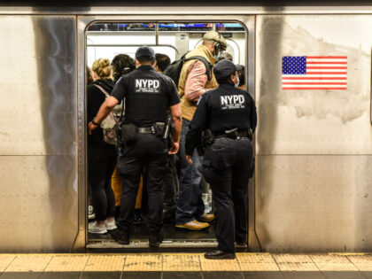New York Police Department (NYPD) officers enter a subway at a station in New York, US, on Wednesday, May 25, 2022. New York City's subway system is carrying fewer riders than expected this year as crime has spiked, including a fatal shooting on Sunday and a violent subway attack last month …