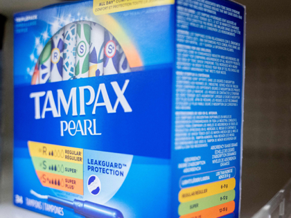 A box of Tampax Pearl tampons are seen on a shelf at a store in Washington, DC, on June 14, 2022. - Tampons have reportedly been in short supply in stores across the United States due to global supply chain issues, according to US media. (Photo by Stefani Reynolds / …