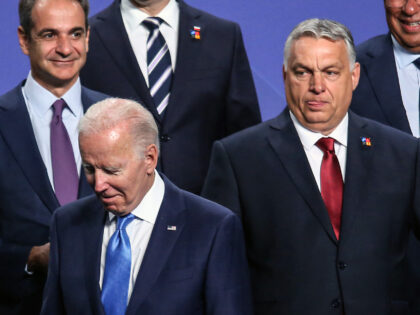 Kyriakos Mitsotakis, Greece's prime minister, left, US president Joe Biden, center, and Viktor Orban, Hungary's prime minister, at the 'family' photo on day two of the NATO summit at the Ifema Congress Center in Madrid, Spain, on Wednesday, June 29, 2022. Finland and Sweden were formally invited to join NATO …