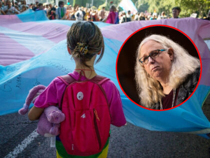 MADRID, SPAIN - 2022/07/09: A girl holds the Transgender Pride flag during the pride march held in one of the most important streets of Madrid. Thousands of people participated in the Madrid pride parade. After two years the march returned to normal with its floats that have characterised it years …