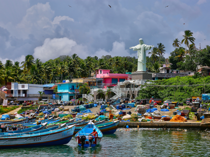 Statue of Christ the Redeemer overlooks fishing boats at Vizhinjam Harbour in Vizhinjam, Thiruvananthapuram (Trivandrum), Kerala, India on May 26, 2022. (Photo by Creative Touch Imaging Ltd./NurPhoto via Getty Images)