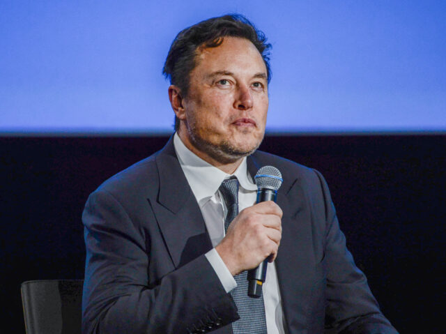 Tesla CEO Elon Musk looks up as he addresses guests at the Offshore Northern Seas 2022 (ON