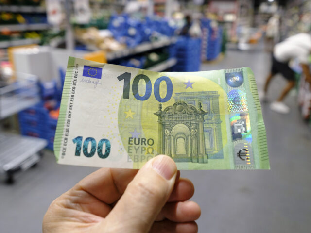 BRUSSELS, BELGIUM - SEPTEMBER 2: A 100 Euro banknote is seen in a supermarket in Etterbeek