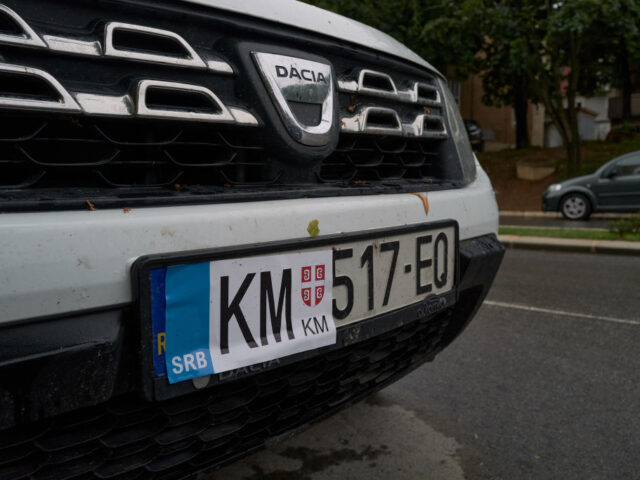 MITROVICA KOSOVO - SEPTEMBER 2: A Kosovar vehicle registration plate is covered with a sti