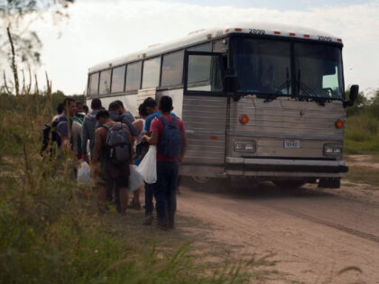 Migrants board a US Border Patrol transport bus after they illegally crossed the US southern border with Mexico on October 9, 2022 in Eagle Pass, Texas. - In the 2022 fiscal year US Customs and Border Patrol (CBP) has had over 2 million encounters with migrants at the US-Mexico border, …