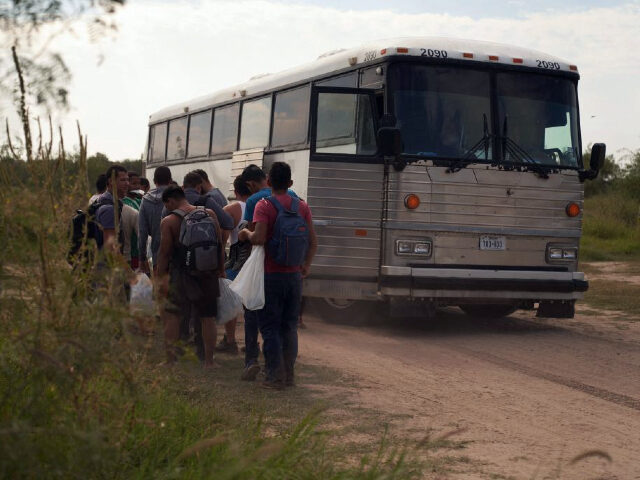Migrants board a US Border Patrol transport bus after they illegally crossed the US southe