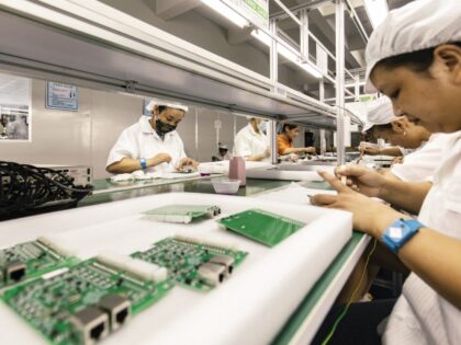 Employees on the integrated circuit board production line at the Smart Pioneer Electronics Co. factory in Suzhou, China, on Friday, Sept. 23, 2022. In a world where chips are becoming smarter and smaller, they require much less advanced technology to manufacture and therefore command smaller margins. Photographer: Qilai Shen/Bloomberg