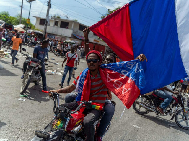 People protest during a demonstration against Haitian Prime Minister Ariel Henry and the U