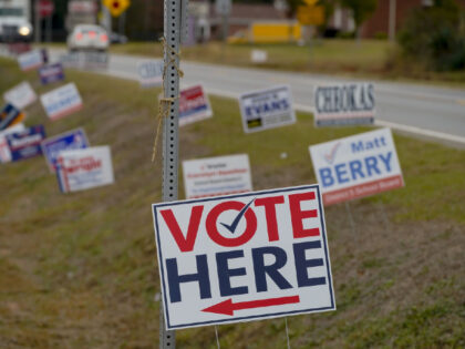 A sign directs voters to a polling location as early voting continues for the midterm elections in Americus, Georgia, US, on Tuesday, Oct. 25, 2022. Although Abrams is winning the money race -- having raised $85 million compared to Kemp's $68 million, according to the candidates' latest filings -- she …