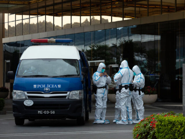 Police officers wearing personal protective guard the entrance of MGM Cotai casino resort, developed by MGM China Holdings Ltd., placed under lockdown due to Covid-19 in Macau, on Sunday, Oct. 30, 2022. Macau will require residents to undergo three days of rapid Covid tests, dampening hopes that the enclave would …