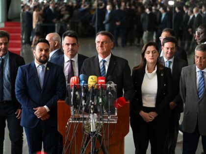 Brazilian President Jair Bolsonaro (C) makes a statement for the first time since Sunday's presidential run-off election, at Alvorada Palace in Brasilia, on November 1, 2022. - Brazil's Bolsonaro sais will 'comply' with constitution after poll loss. (Photo by EVARISTO SA / AFP) (Photo by EVARISTO SA/AFP via Getty Images)